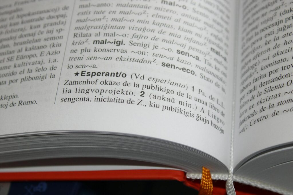 An open reference book of typographic terms, showing letterforms with anatomy labels.